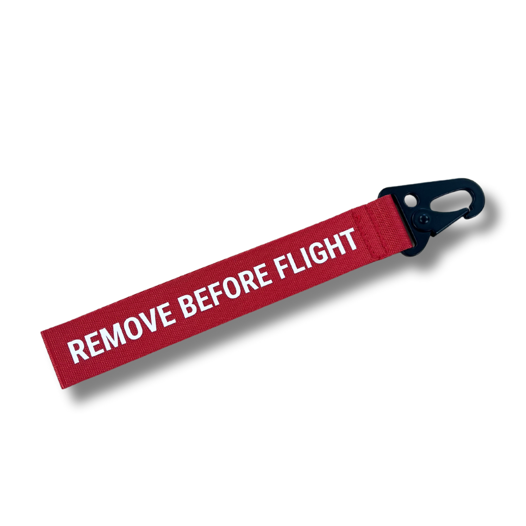 Red remove before flight tag hot sale